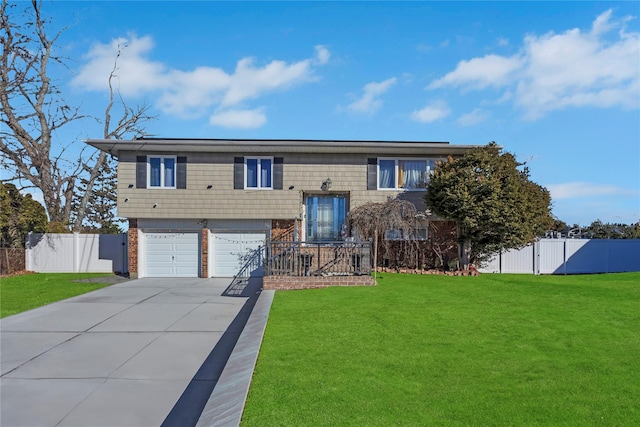 bi-level home with a front yard and a garage