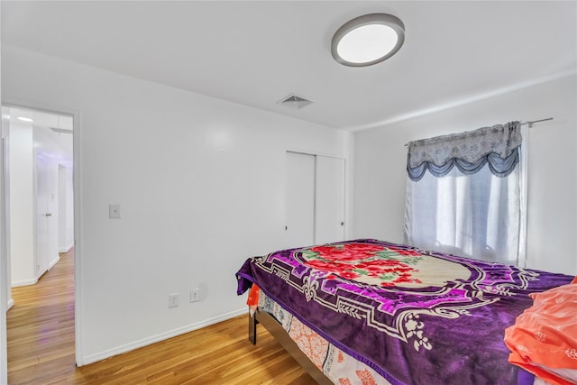 bedroom with hardwood / wood-style floors