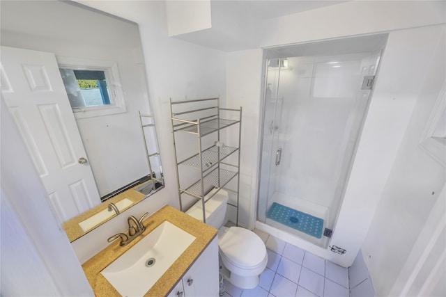 bathroom featuring walk in shower, tile patterned flooring, vanity, and toilet