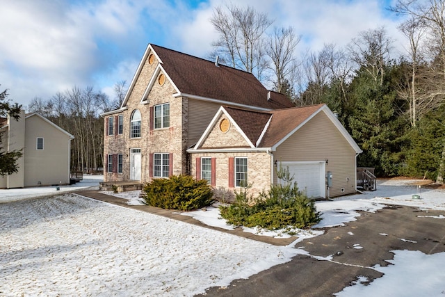 front of property with a garage