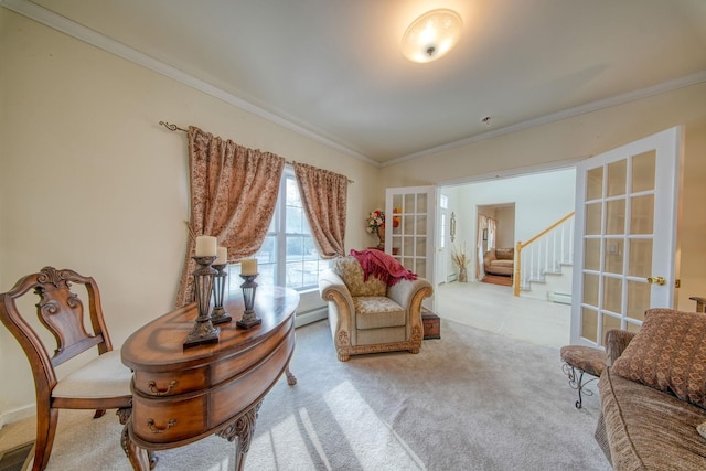 living area featuring carpet flooring, crown molding, a baseboard radiator, and french doors