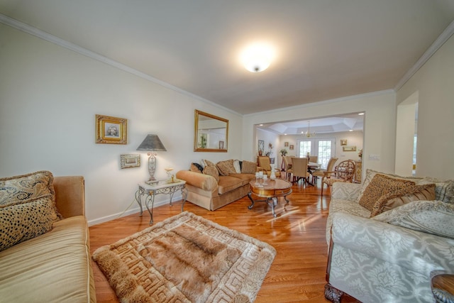 living room featuring wood-type flooring and crown molding