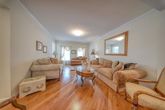 living room with light wood-type flooring and ornamental molding