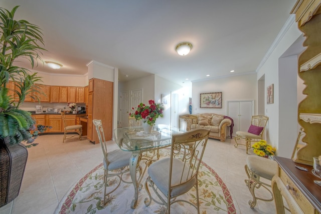 tiled dining room featuring ornamental molding