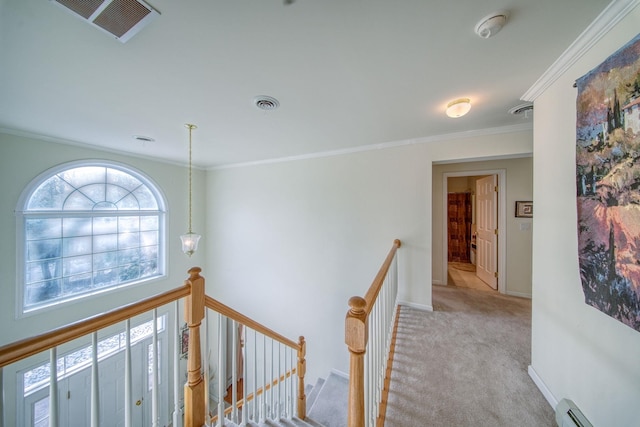 corridor featuring light colored carpet, baseboard heating, and crown molding