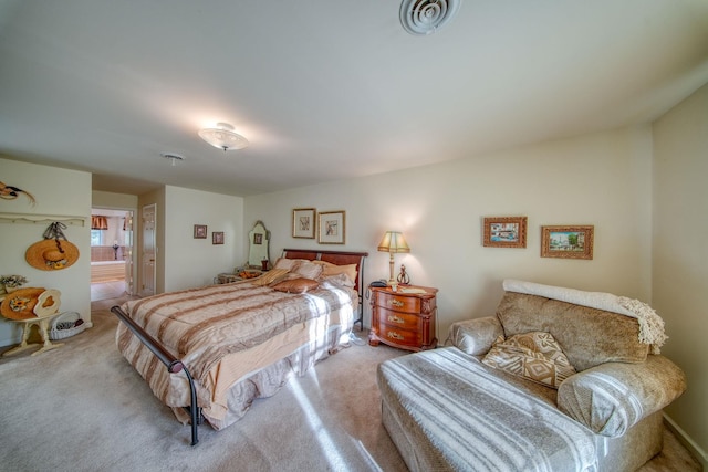 bedroom featuring light colored carpet