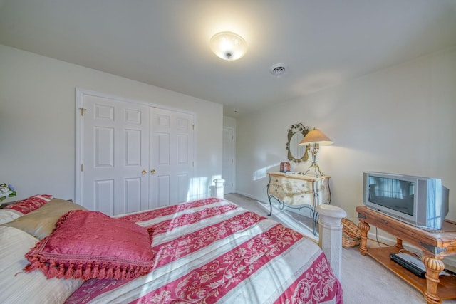 carpeted bedroom with a closet