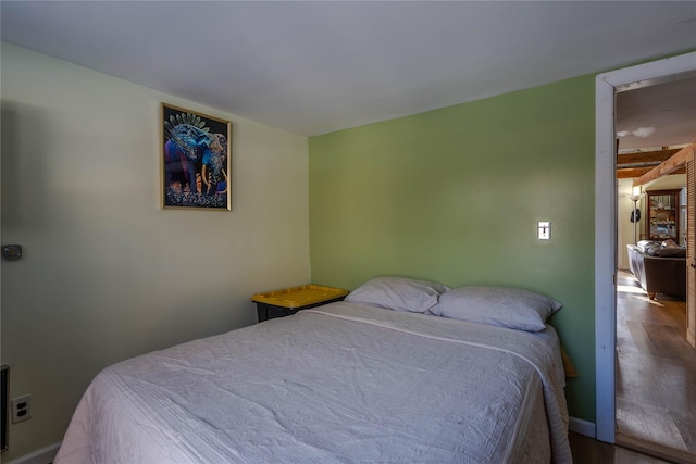 bedroom with hardwood / wood-style floors