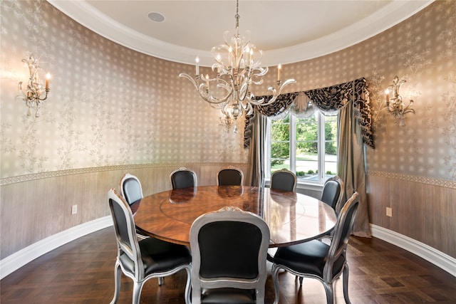 dining room featuring dark parquet floors, an inviting chandelier, and crown molding