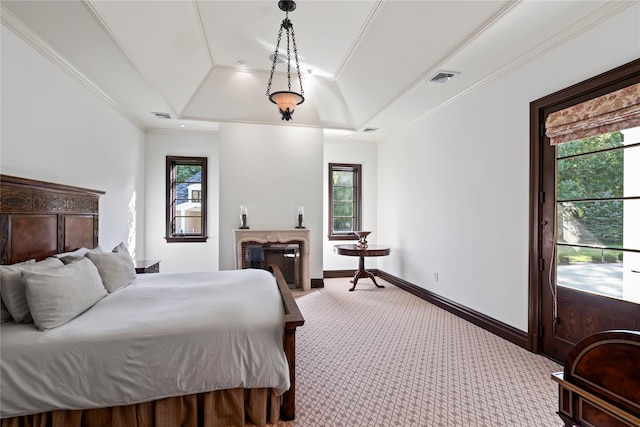 bedroom featuring light colored carpet, a raised ceiling, multiple windows, and crown molding