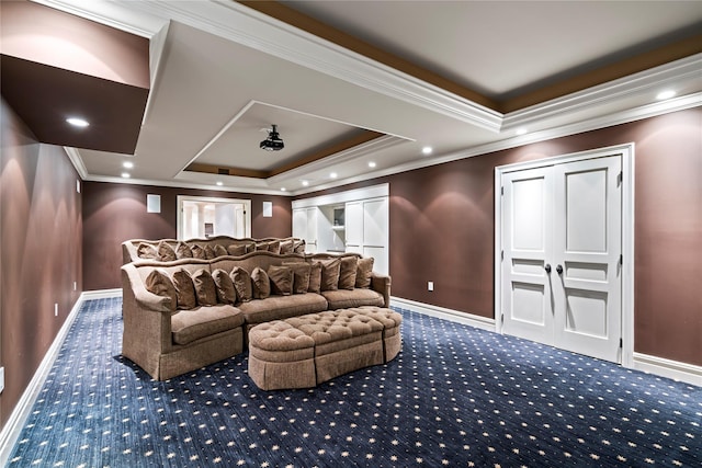 home theater featuring carpet, a raised ceiling, and ornamental molding