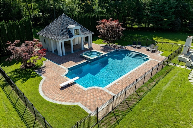 view of swimming pool featuring an in ground hot tub, a patio, a diving board, and a lawn