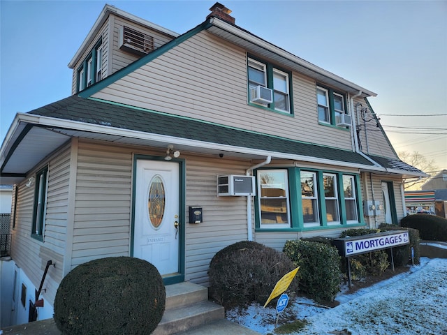 view of front of home featuring cooling unit