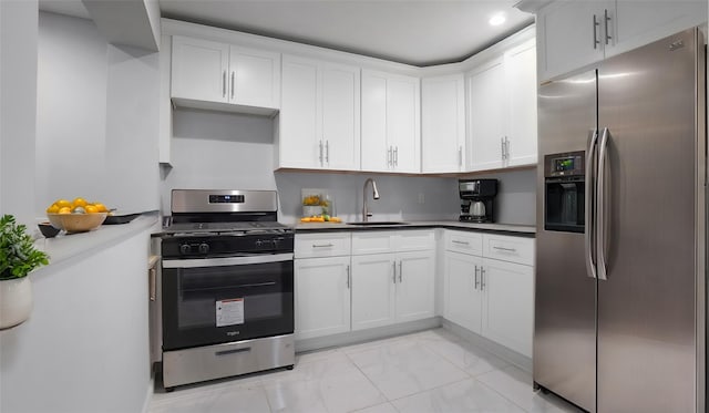 kitchen featuring white cabinets, sink, and stainless steel appliances