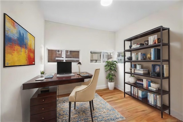 office space featuring light wood-type flooring