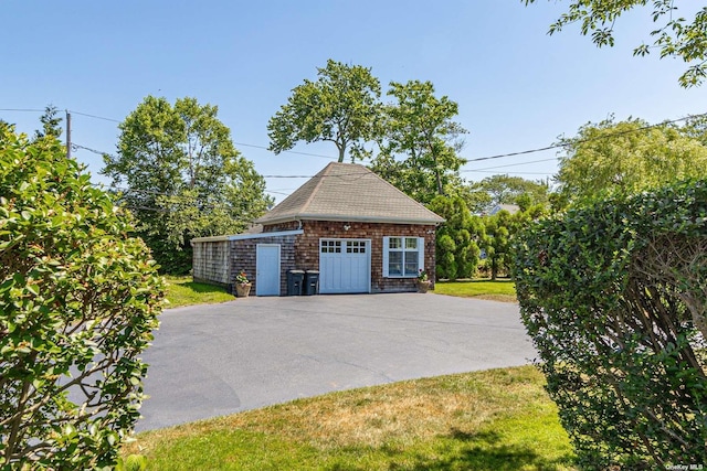 garage with a lawn