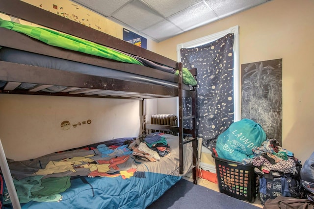 bedroom with a drop ceiling