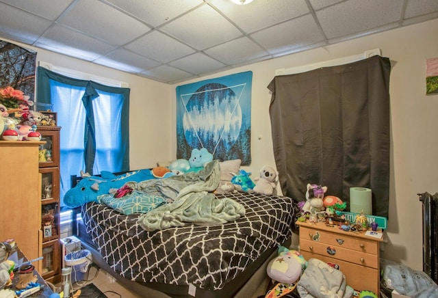 bedroom featuring a drop ceiling