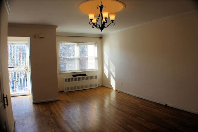 unfurnished room featuring dark hardwood / wood-style flooring, radiator heating unit, crown molding, and a chandelier