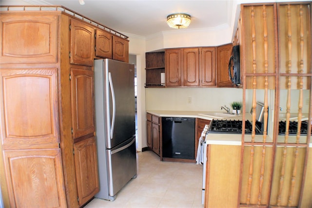 kitchen featuring crown molding, sink, light tile patterned floors, and black appliances