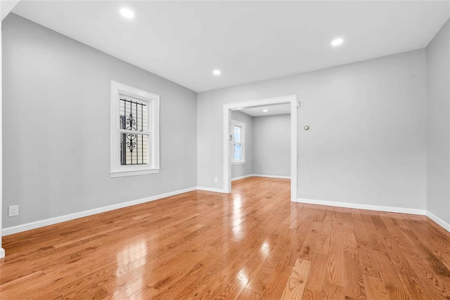 unfurnished room featuring light hardwood / wood-style flooring