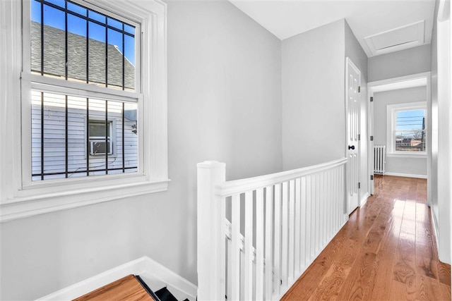 hall with hardwood / wood-style floors