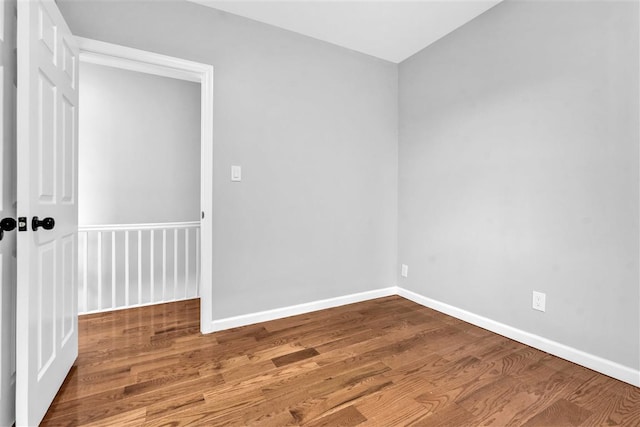 spare room featuring hardwood / wood-style floors