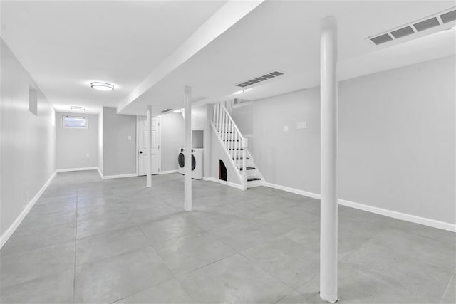 basement with washing machine and dryer