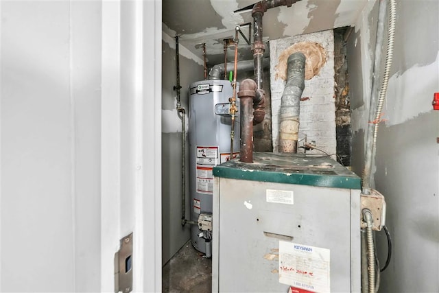 utility room featuring water heater