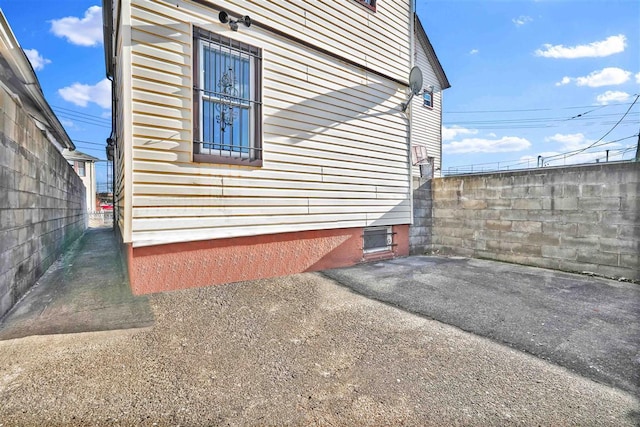 view of side of home featuring a patio area