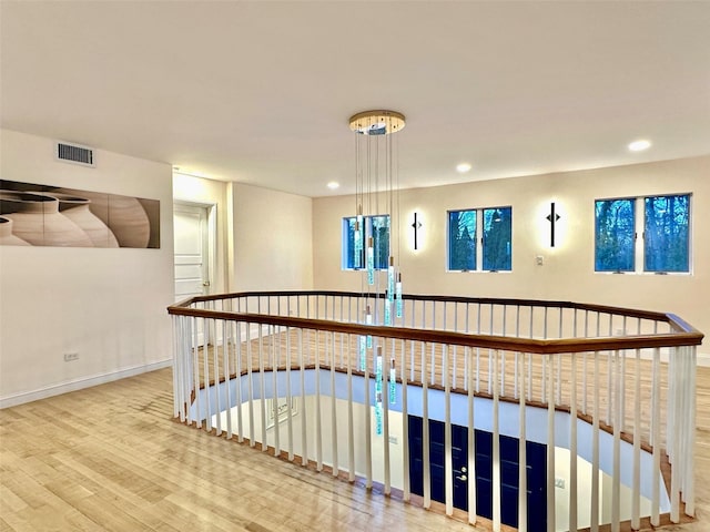 stairs featuring hardwood / wood-style flooring