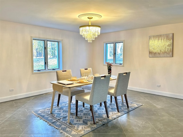 dining space featuring a notable chandelier