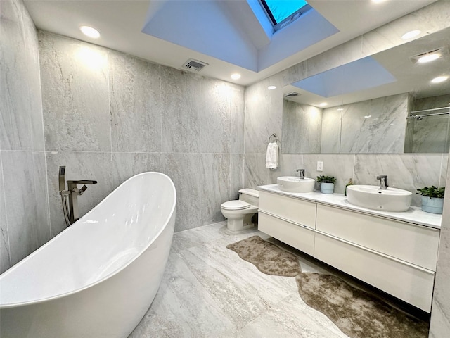 full bathroom with toilet, lofted ceiling with skylight, tile walls, and independent shower and bath