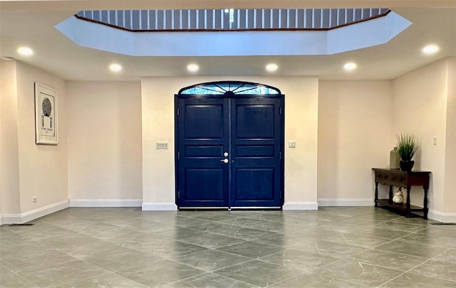 entrance foyer featuring a skylight