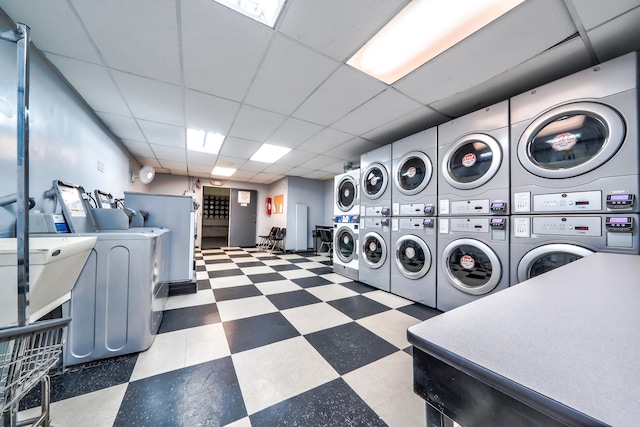 laundry room featuring stacked washer / dryer and washing machine and dryer