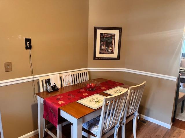 dining area featuring hardwood / wood-style flooring