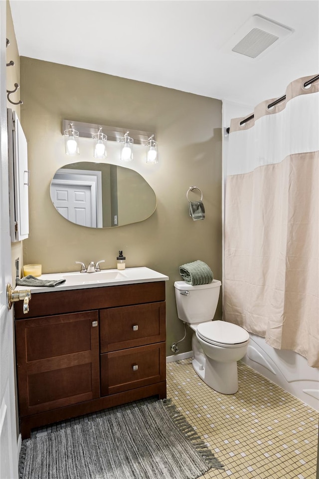 full bathroom featuring toilet, vanity, tile patterned floors, and shower / bathtub combination with curtain