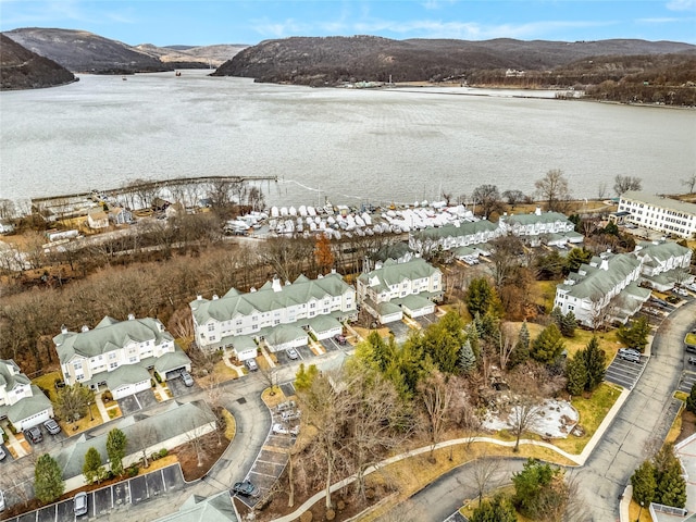 aerial view featuring a water and mountain view