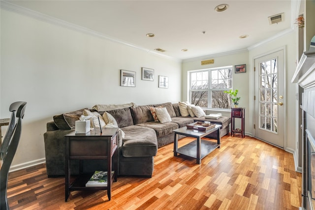 living room featuring crown molding and wood-type flooring