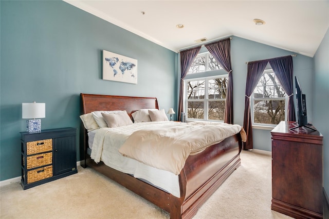 bedroom with lofted ceiling and light carpet