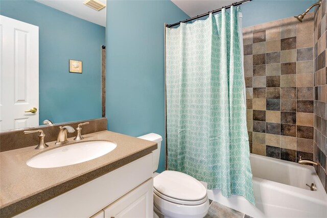 full bathroom featuring toilet, shower / bathtub combination with curtain, and vanity