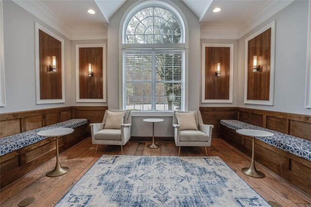 living area featuring vaulted ceiling, a healthy amount of sunlight, and breakfast area