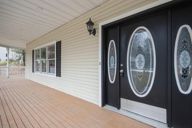 doorway to property with a porch