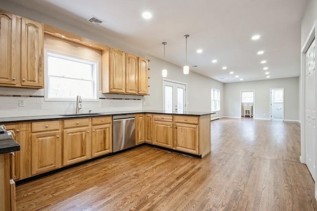 kitchen with dishwasher, light wood-type flooring, hanging light fixtures, and sink