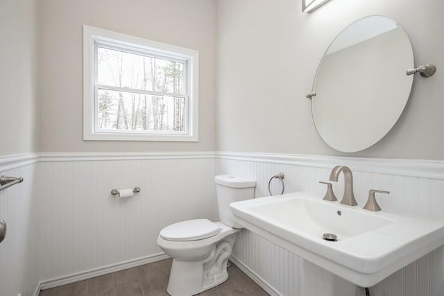 bathroom featuring sink and toilet