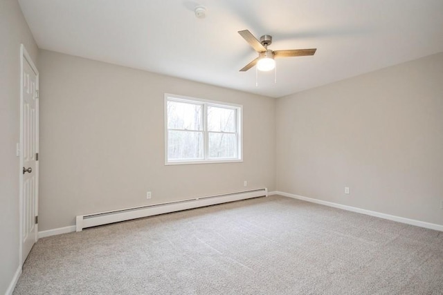 carpeted spare room featuring ceiling fan and a baseboard radiator