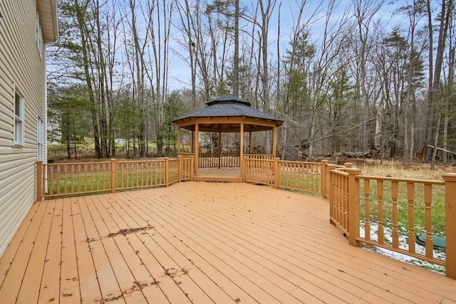 wooden terrace featuring a gazebo