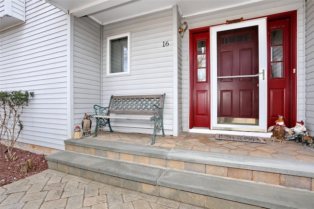 property entrance with covered porch