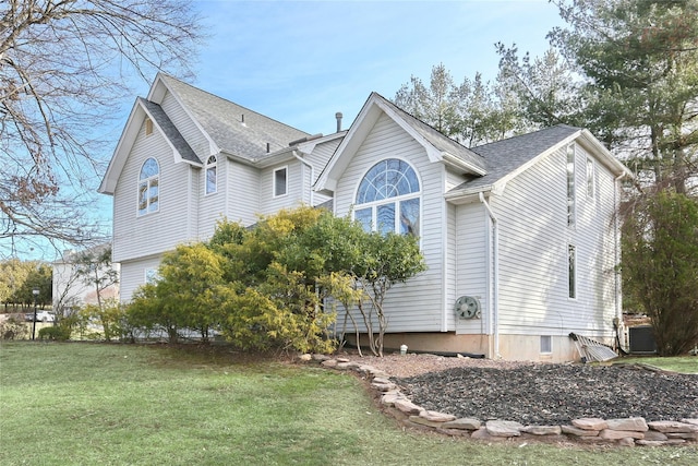 view of property exterior featuring central air condition unit and a lawn