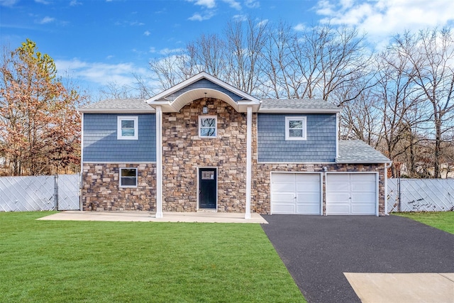 front of property with a garage and a front yard